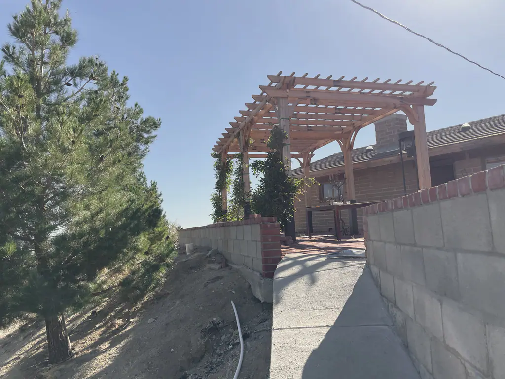 The pergola walkway beside the house